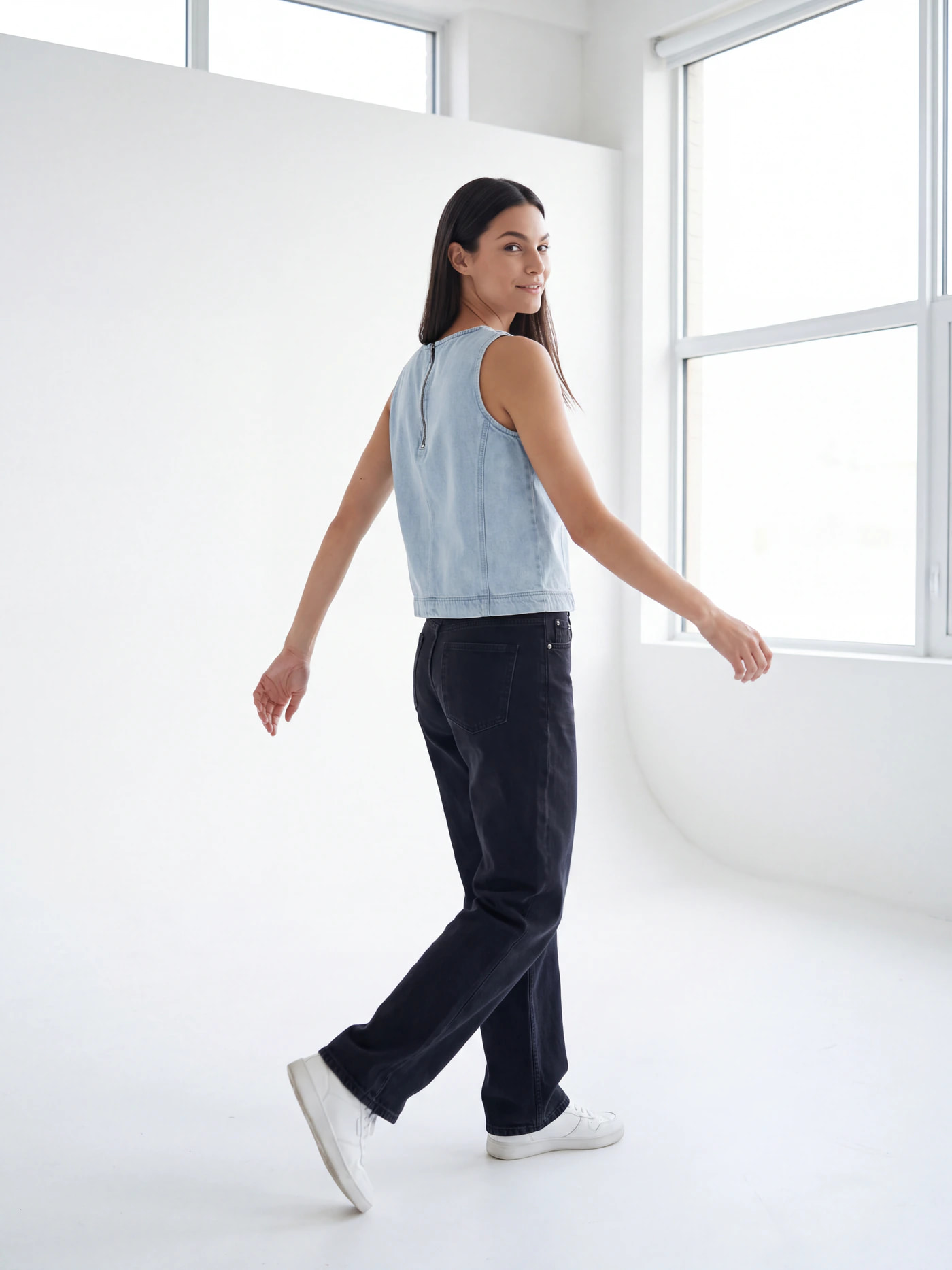 The same denim top generated onto a model by Nokkh, studio lit